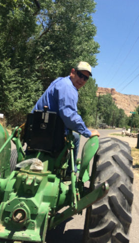 Trent heading out to the peach orchards on his farm tractor..